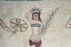 Girl gymnast crowned with flowers and wearing a bikini, fourth century Roman Villa del Casale, near Piazza Armerina, Sicily, Italy
