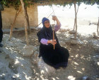 Bedouin woman spinning wool, Jordan