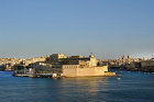 Vittoriosa, Castel St Angelo, founded circa 1200, restored in sixteenth century, seen over the Grand Harbour from Valletta, Malta