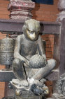 Monkey holding a jack fruit, Golden temple, Patan, Nepal