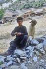 Pakistan, Kalash boy with goat