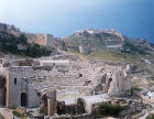 Greco-Roman theatre, walls of castle above, Solunto, Spain