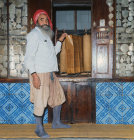 Tunisia Island of Djerba, Rabbi in synagogue with Torah dating from 600 AD