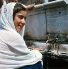 Young girl at ablutions fountain, U? ?erefeli Mosque, Edirne, Turkey