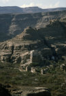 Yemen, rock palace in Wadi Dahr and mountains